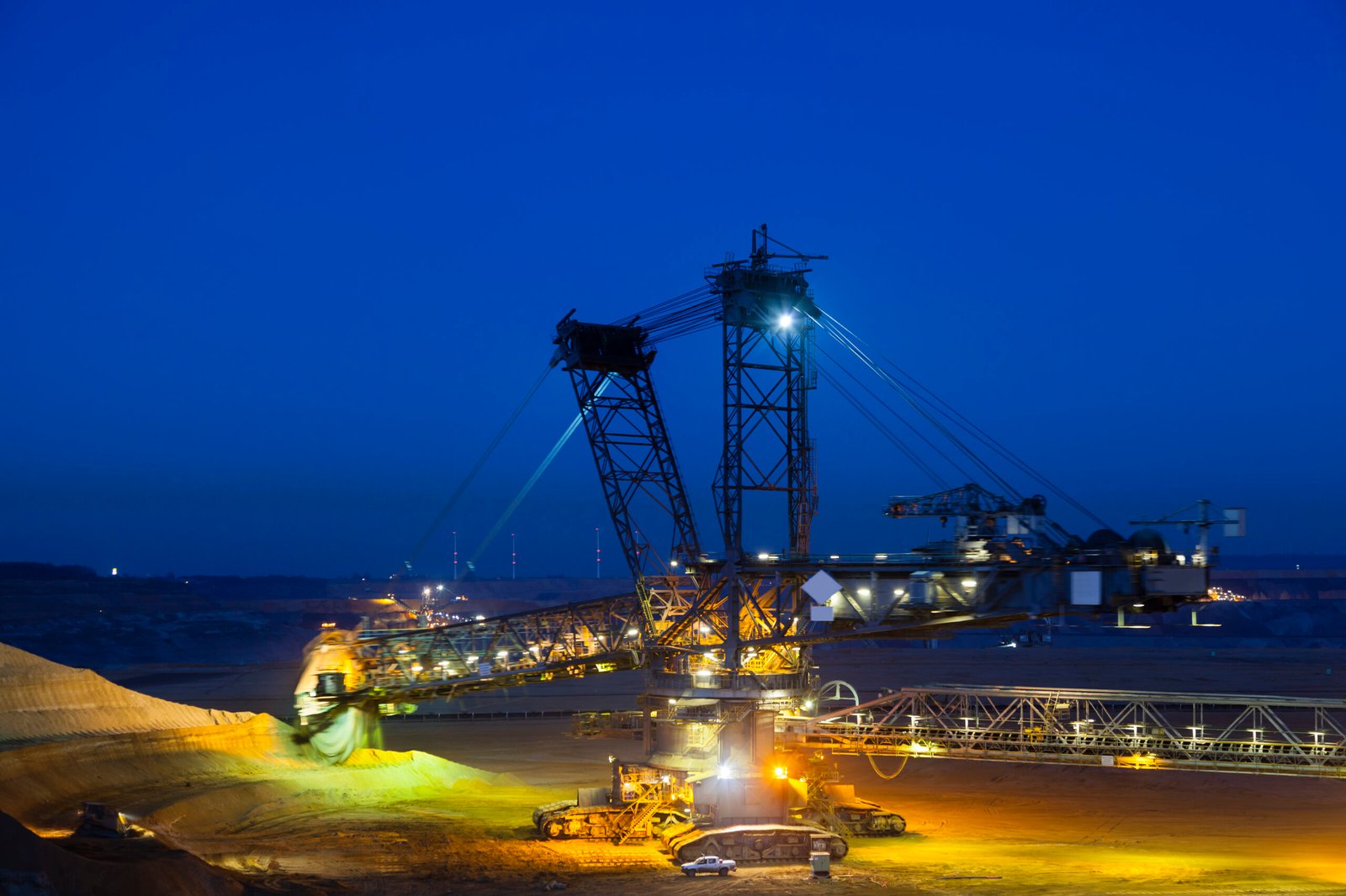 Bucket Wheel Excavator At Night A giant Bucket Wheel Excavator at work in a lignite pit mine at night with some motion blur