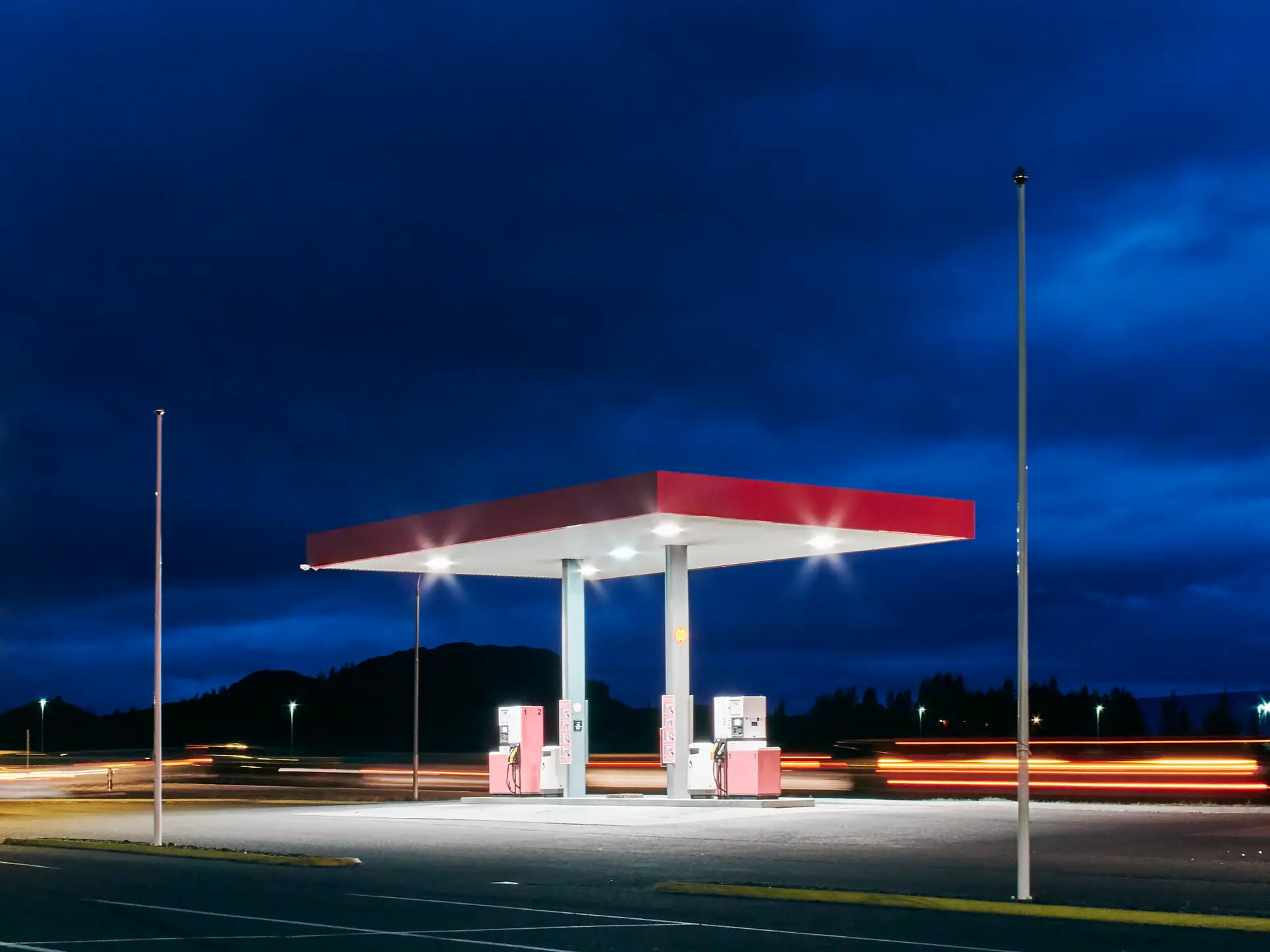Empty floodlit gas station at night, Hof, Iceland